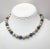 This is part of Chairish’s Costume Jewelry assortment. Circa 1967 textured goldtone, blackened metal and rhodium plated...