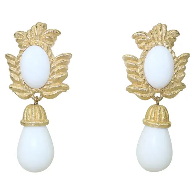 1980's glam at its finest! Givenchy dangle earrings featuring a gold plated base resembling palm fronds with detailed...