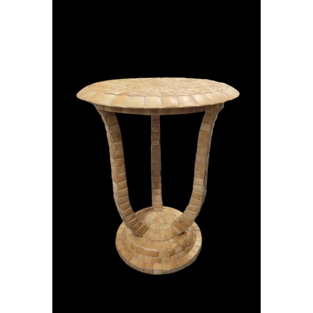 A beautiful very unusual round tesselated tile side table by Maitland Smith. This is a very unique table.. The table is...