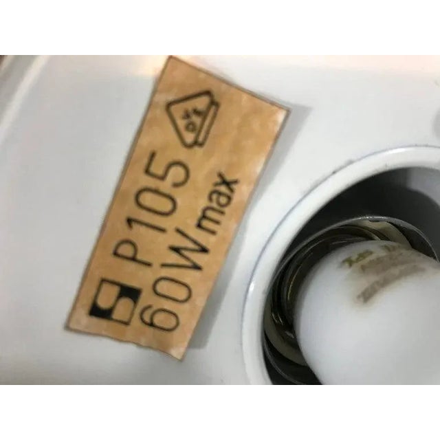 Pair of staff hanging lamps made in Germany in the 1970s. Elegant chrome bar. The lamp shade is made of opaline glass.