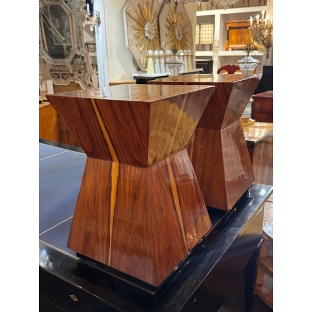 This product is a pair of modern exotic wood side tables, perfect for those looking to add a unique touch to their home...