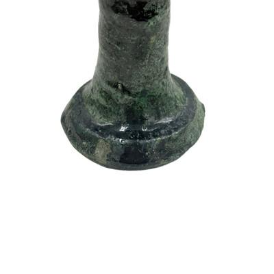 A Moroccan Tamegroute glazed candlestick holder is a handcrafted piece made in the historic pottery village of Tamegroute...