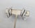 1960s rhodium plated baguette and round clear rhinestone swirl clip earrings. Marked "KRAMER©" on the clips. Measure: 1...