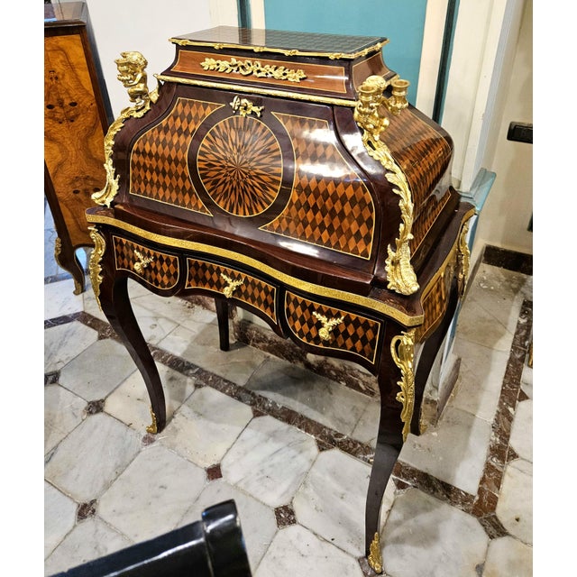 A truly distinctive statement piece, this French-inspired writing desk showcases an exceptionally ornate combination of...