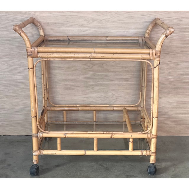 Mid-Century Modern bamboo tea cart, Fabulous from the 1950s. Made in bamboo with four wheels. Bottle rack on the low...