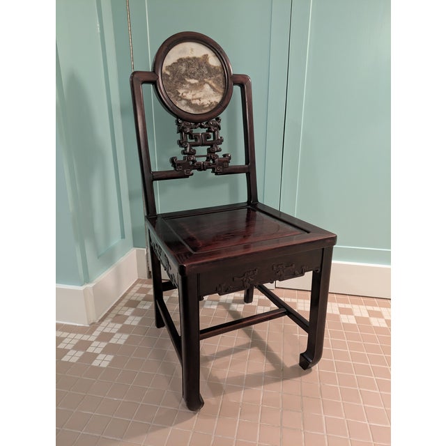 Listed is antique Chinese Rosewood side chair with a fabulous marble medallion inlay back splat. This stunning chair is...