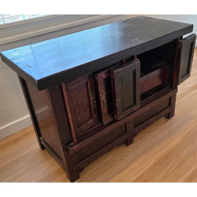 Antique Chinese lacquer cabinet, probably from Fujian or the southern coastal region, dating to circa 1900. The compact...