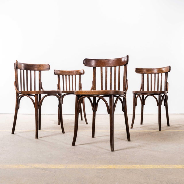 1950’s Dark Oak Bistro Bentwood Dining Chairs. Good quality classic bentwood chairs with a deep dark oak colour and...