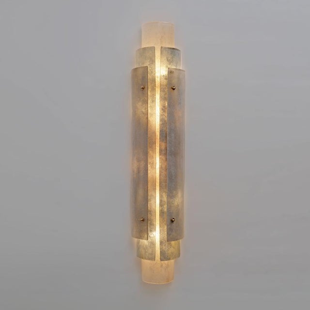 Pair of vertical murano glass wall sconces with scavo finish and brass details an elegant pair of vertical murano glass...