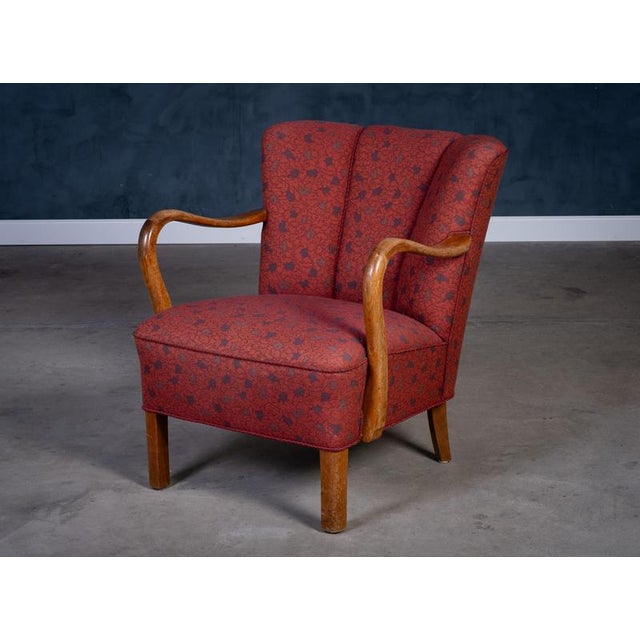 Elegant Art Deco Danish lounge chair from the 1950s, attributed to renowned Danish designer Viggo Boesen. Beautifully...