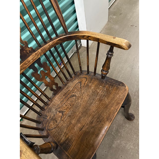 Pair of English oak Windsor Chairs with the old finish and attractive wear to the arms and seats. The chairs are very...