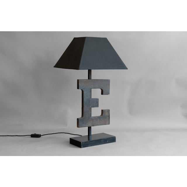 Antique shop sign letter "E" lamp with newly fabricated base and stand. Re-wired and tested. Shade not included. U.K circa...