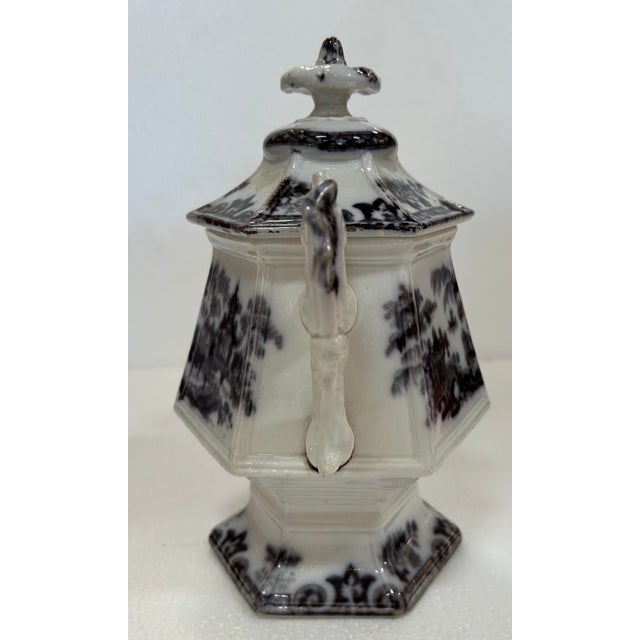 Antique 19C English Mulberry ware tureen. Pattern is of Staffordshire pottery. Hexagon shape, ornate handles.