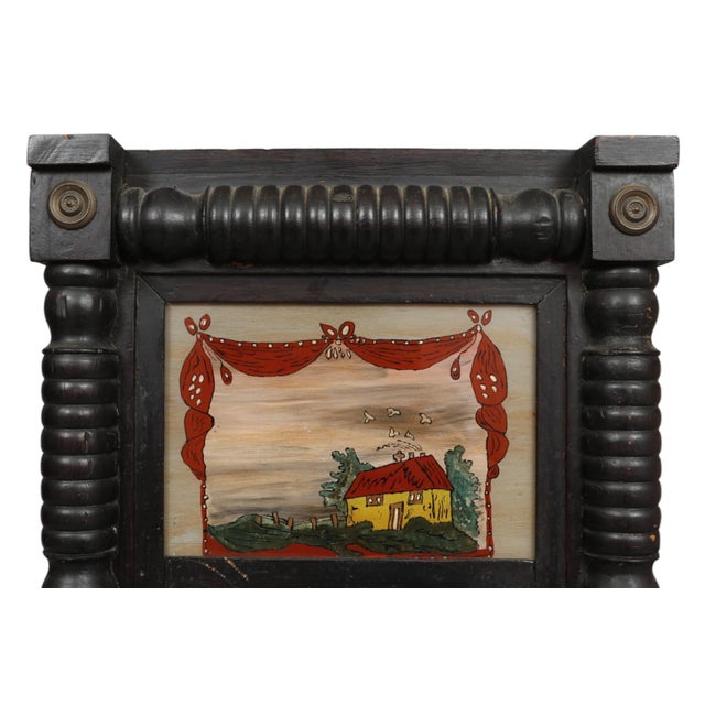 A Federal period Trumeau mirror, circa 1820. The tall rectangular mirror is framed with a turned beveled wood trim in...