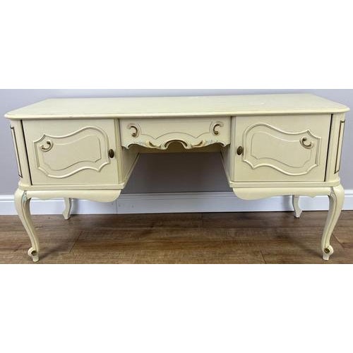 This charming vintage shabby chic Louis sideboard showcases elegant curved lines, decorative detailing, and a soft painted...