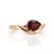Indulge in the dramatic beauty of this deep red, pear-shaped Garnet ring. The 7x5mm solitaire gemstone is nestled...