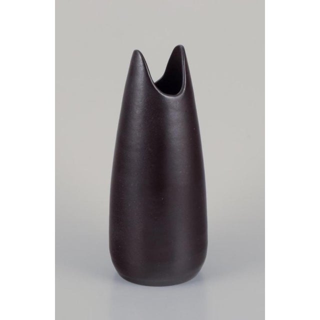 Mari Simmulson (1911-2000) for Upsala Ekeby. Ceramic vase with dark brown glaze. Mid-20th century. Marked. In perfect...