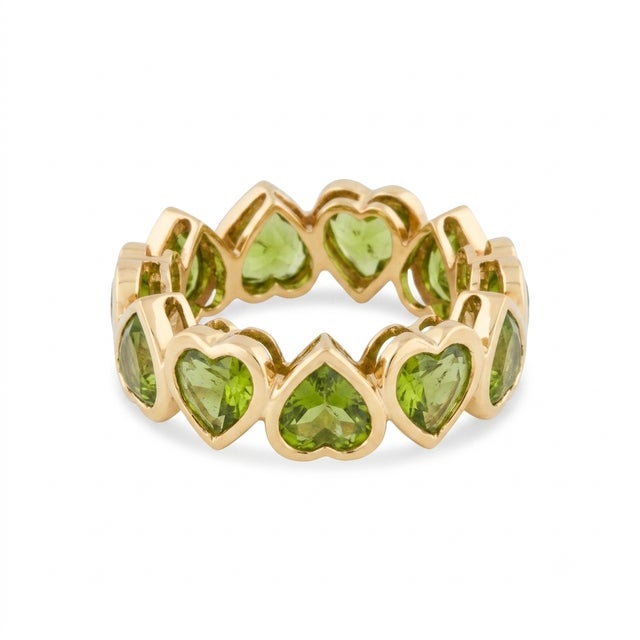 Capture the essence of romance with this enchanting eternity band. This exquisite piece features a continuous loop of...
