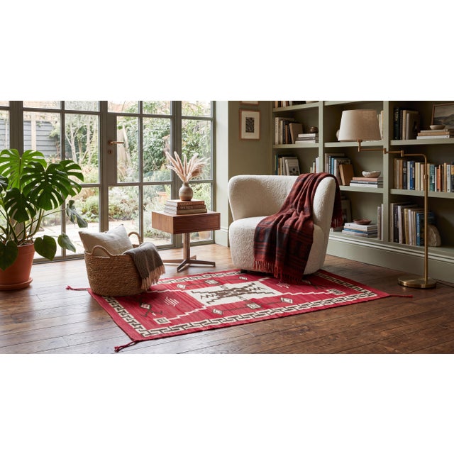 Elevate luxury interiors with this striking handmade wool textile, inspired by traditional Navajo craftsmanship and...