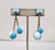Early 1950s goldtone white and turquoise resin round domed checked top with two spherical white & turquoise checked drops...
