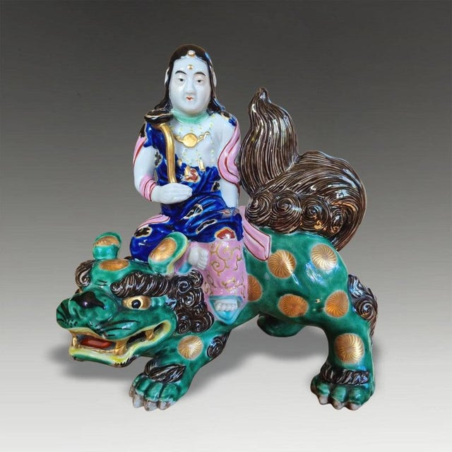 An exceptionally decorative Japanese Kutani porcelain sculptural group dating to the Meiji period and depicting Guanyin...