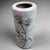 This elegant cylinder vase is a stunning example of traditional Shino pottery, known for its warm, organic shapes and...