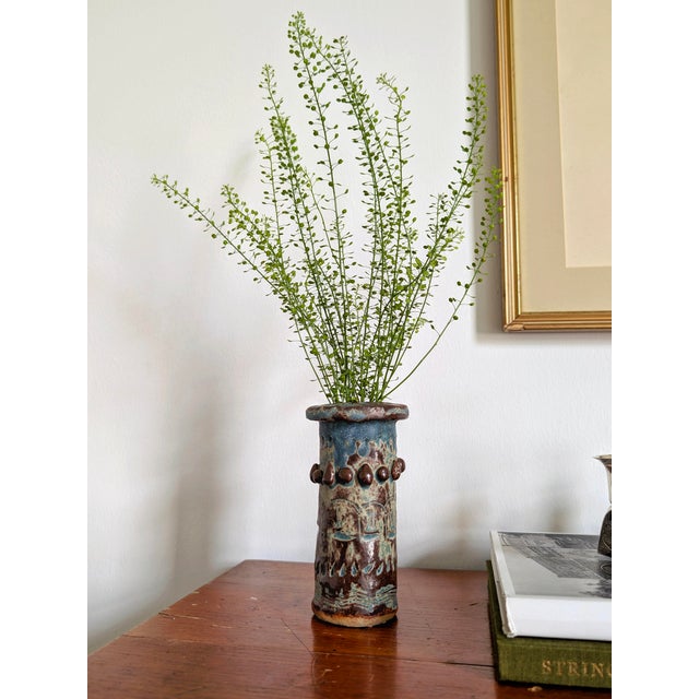 Vintage brutalist ceramic vase with matte blue, green and brown glaze. This unique 70s primitive pottery piece, signed to...