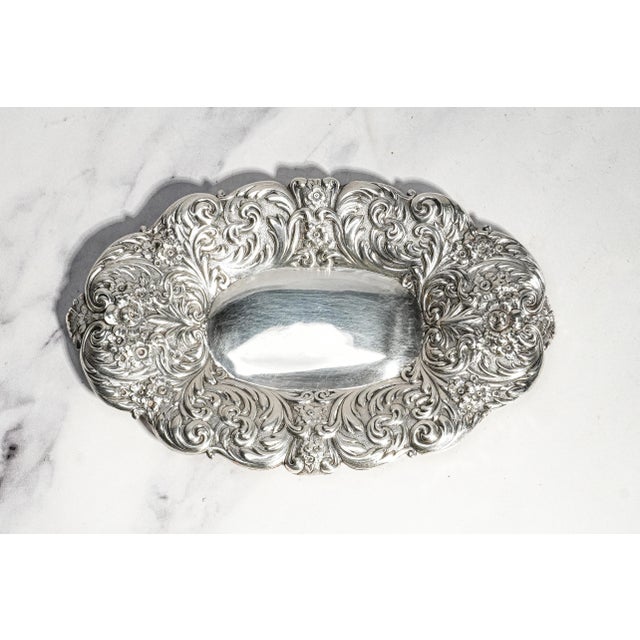 Exemplifying the exceptional artistry of Gorham Manufacturing Company, this magnificent circa 1900 sterling silver tray is...