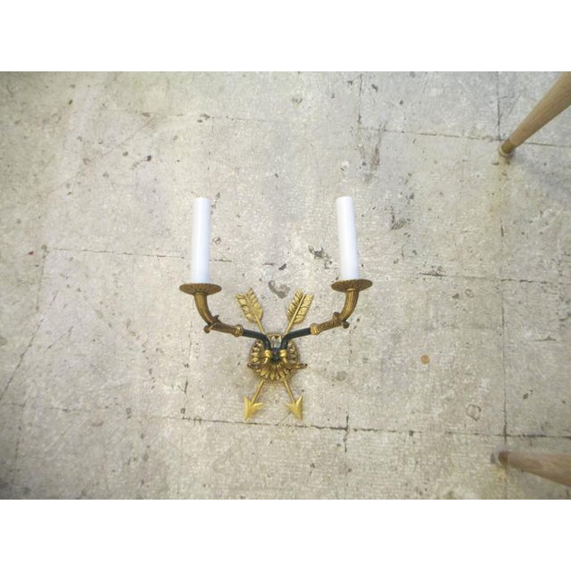 Pair of directoire-style two-arm bronze sconces.