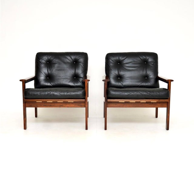 A stunning pair of Danish Capella armchairs by Illum Wikkelso. They were made in Denmark in the 1960’s. The quality is...