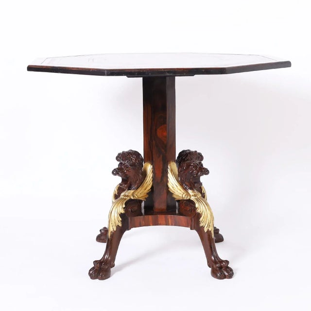 Handsome English center table with an octagon tooled brown leather top crossbanded in rose wood on a rosewood pedestal and...