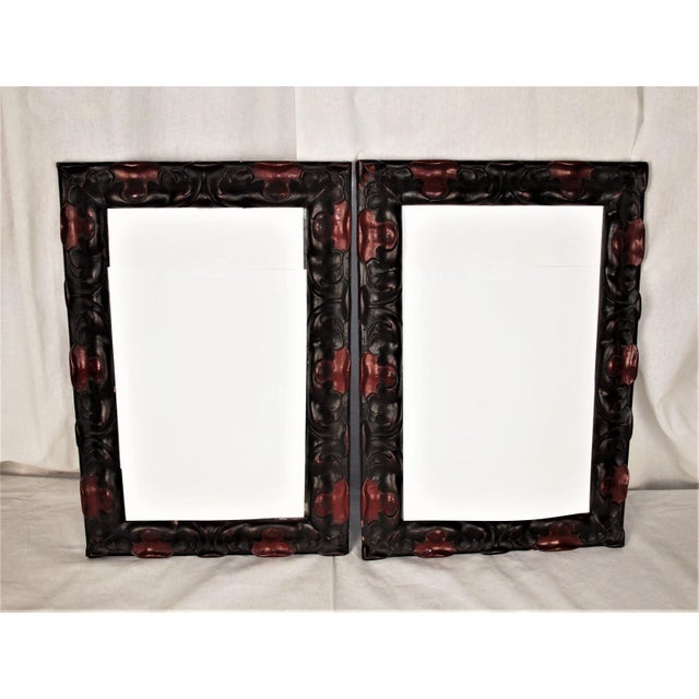 A pair (2) Spanish Art Deco wood carved mirrors. Framed are wood hand carved in a scalloped design and painted red and...