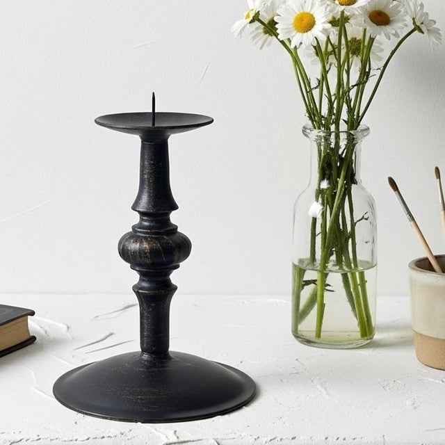 Find Your Calm: Embrace Simplicity with the Zen Candlestick. Introduce an element of profound tranquility and understated...
