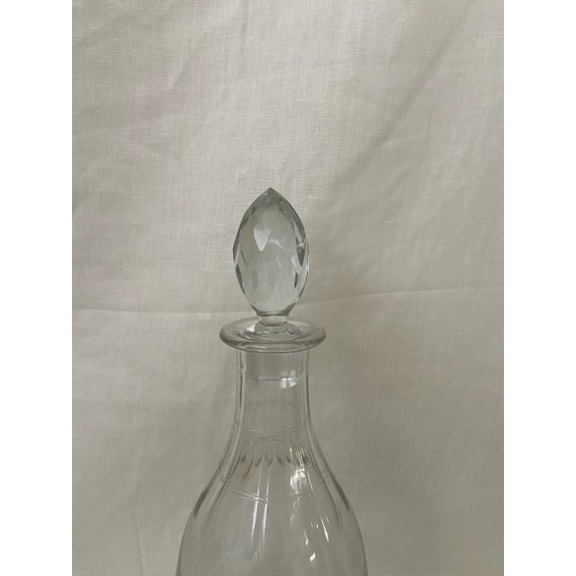 Glass decanter with faceted stopper. Dimensions: 5"diam x 13.5"h to stopper. Beautiful for dinners, brunches or would make...