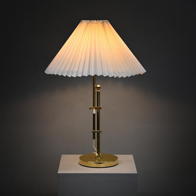Elegant brass table lamp b-131 by bergboms, sweden, 1960s. The vertical stand, to which the lampshade is attached, is...