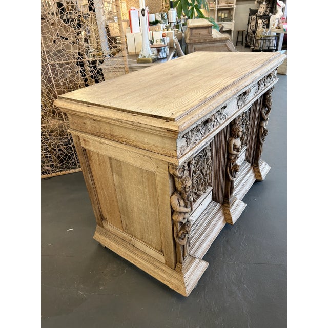 Experience the allure of the 19th-century Italian Renaissance with this weathered oak carved buffet. Rich in history, this...