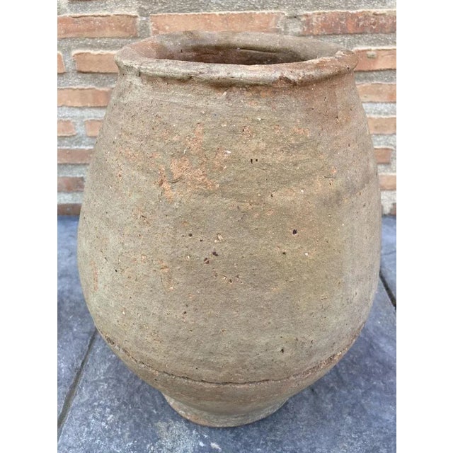 This large old clay vase was created in the south of France, around 1870. Made of blond clay, the tall vase is round in...