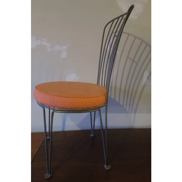 Cast iron garden or patio chair manufactured in the early 20th century. The chair is structurally sound, well-patinated,...