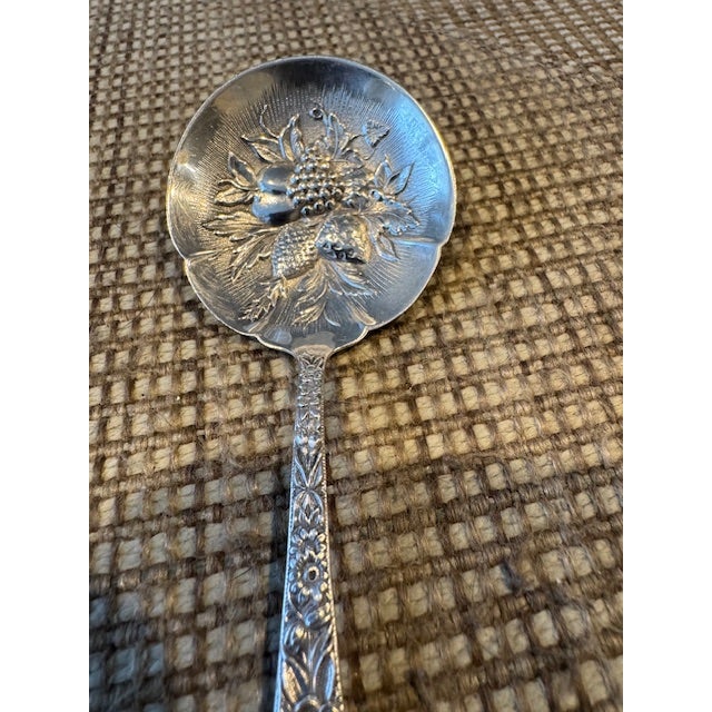Vintage Sterling Silver Kirk Repousse Nut Spoon - 5 3/8". The Vintage Sterling Silver Kirk Repousse Nut Spoon is a...