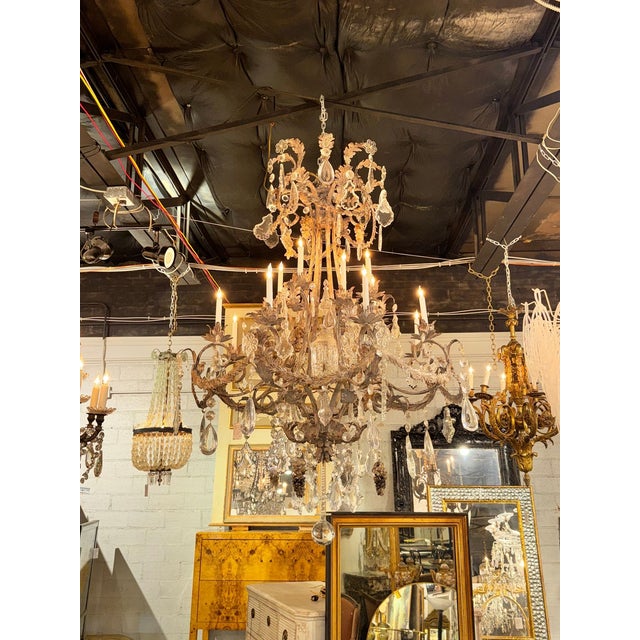 The Patinated Iron and Crystal Chandelier by Ernesto Klun is a stylish and elegant lighting fixture. The chandelier...