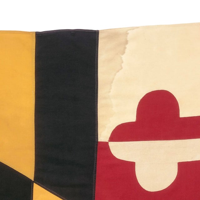 This large vintage flag of Maryland was made in USA from a cotton cloth. Design is entirely sewn and visible on both...