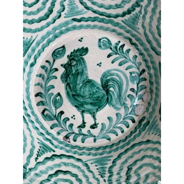 A striking example of traditional Granada pottery, this large hand-thrown earthenware bowl features a vibrant green-glazed...