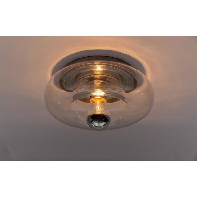 Lovely Mid-Century Modern Glass Donut Wall or Ceiling Lamp, Germany, 1960s The lamp is executed in 1x E27 Edison screw fit...