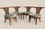 Offered is a set of four wood chairs attributed to William "Billy" Haines. The curved backs are caned. This chic set is...