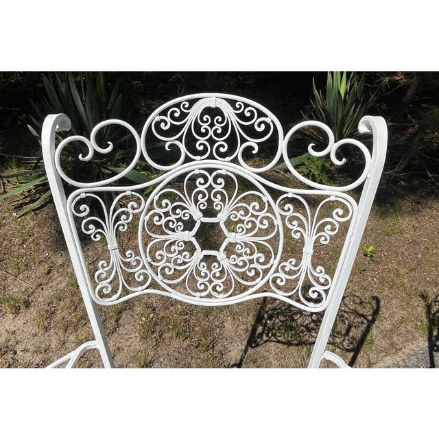This pair of Russell Woodard patio arm chairs are in the Andalusian pattern. The openwork pattern is reminiscent of a...