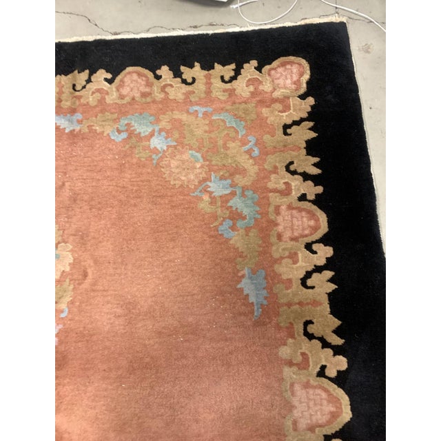 Handmade antique Art Deco Chinese rug in pink and black colors. The rug is from the beginning of 20th century in original...