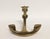 A vintage brass anchor shaped candle holder. The candlestick holds one taper. A great nautical addition to your decor. It...