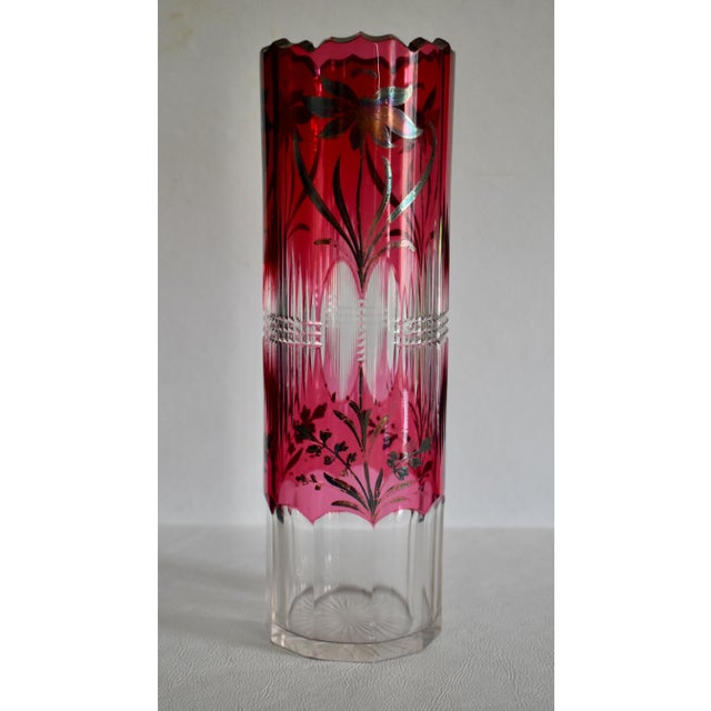 Vintage (1950's) Crystal Vase has a Bohemian Style. Cut Glass Ruby Color with Etched Floral Details.Cylinder Shape. Made...