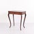 Mahogany side table with a drawer and elegantly curved legs. Dating from around 1910, the table features a classic design...