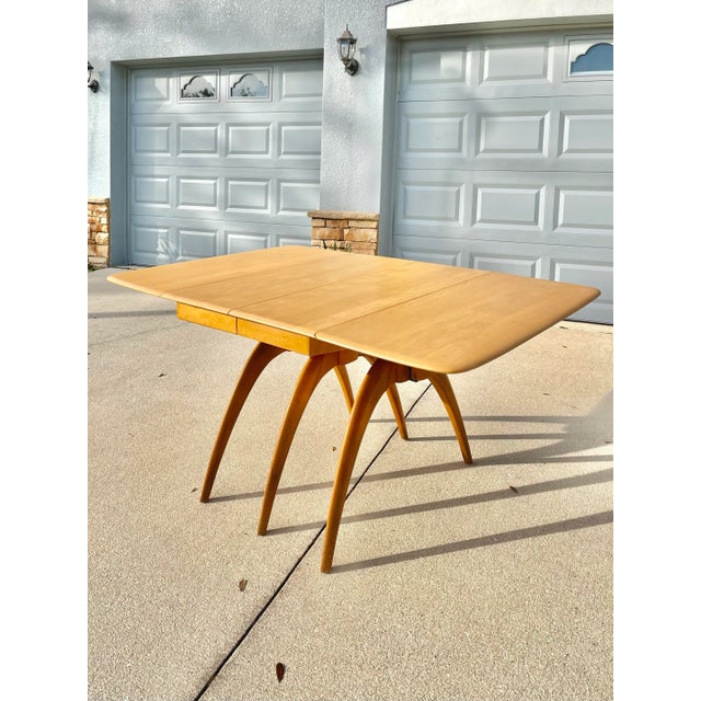Mid Century Modern Extendable Wishbone Dining Table by Heywood Wakefield. This one is quite the looker! With a fully...